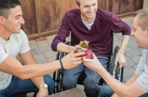 Disabled single friends having a drink together